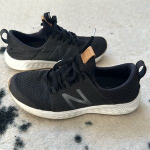 Women’s black New Balance sneakers
